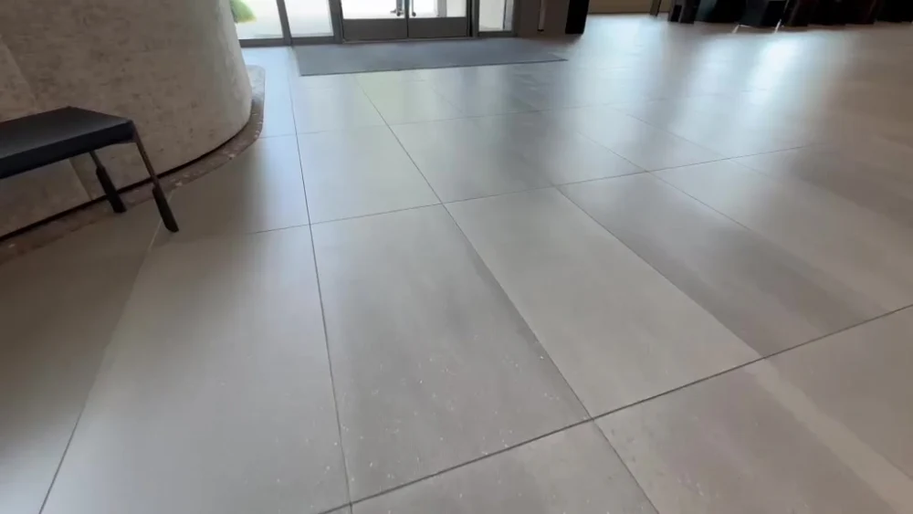 Custom design large-format tile flooring installed by Evolution Tile Inc in a San Diego commercial lobby
